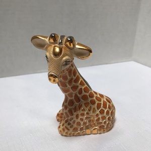 Collectible Giraffe figurine. Stamped on bottom.